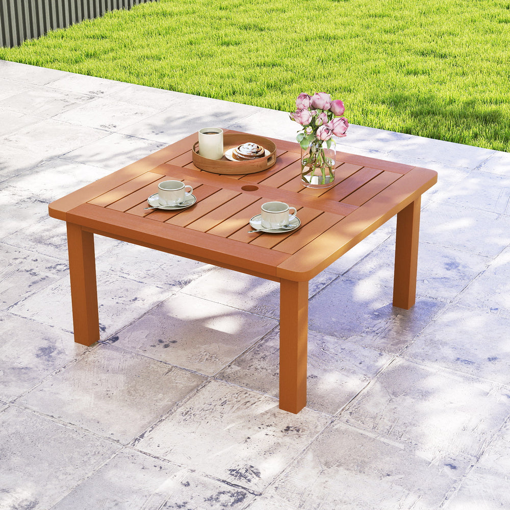 Patio coffee table with a slatted top and teak oil finish, showcasing a sturdy triangular structure for outdoor.