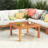 Patio coffee table with teak oil finish, showcasing a slatted top and strong beams, perfect for poolside gatherings.