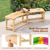 Curved solid wood patio bench with a natural finish, designed for outdoor use, suitable for gardens and poolside.