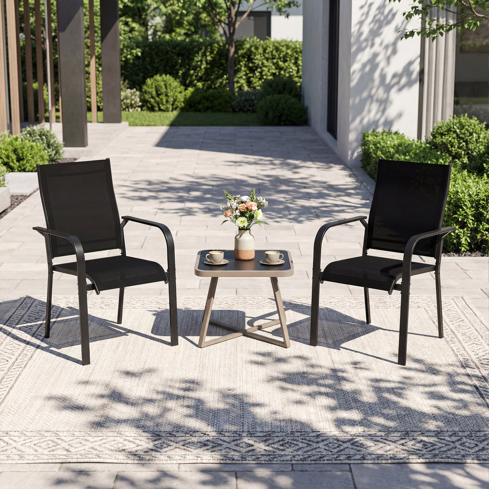 Two stackable outdoor armchairs with metal frame and breathable mesh fabric, perfect for patio dining and relaxation.
