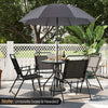 6-piece gray patio dining set featuring folding chairs, a glass table, and a 71" tilt umbrella for outdoor relaxation.