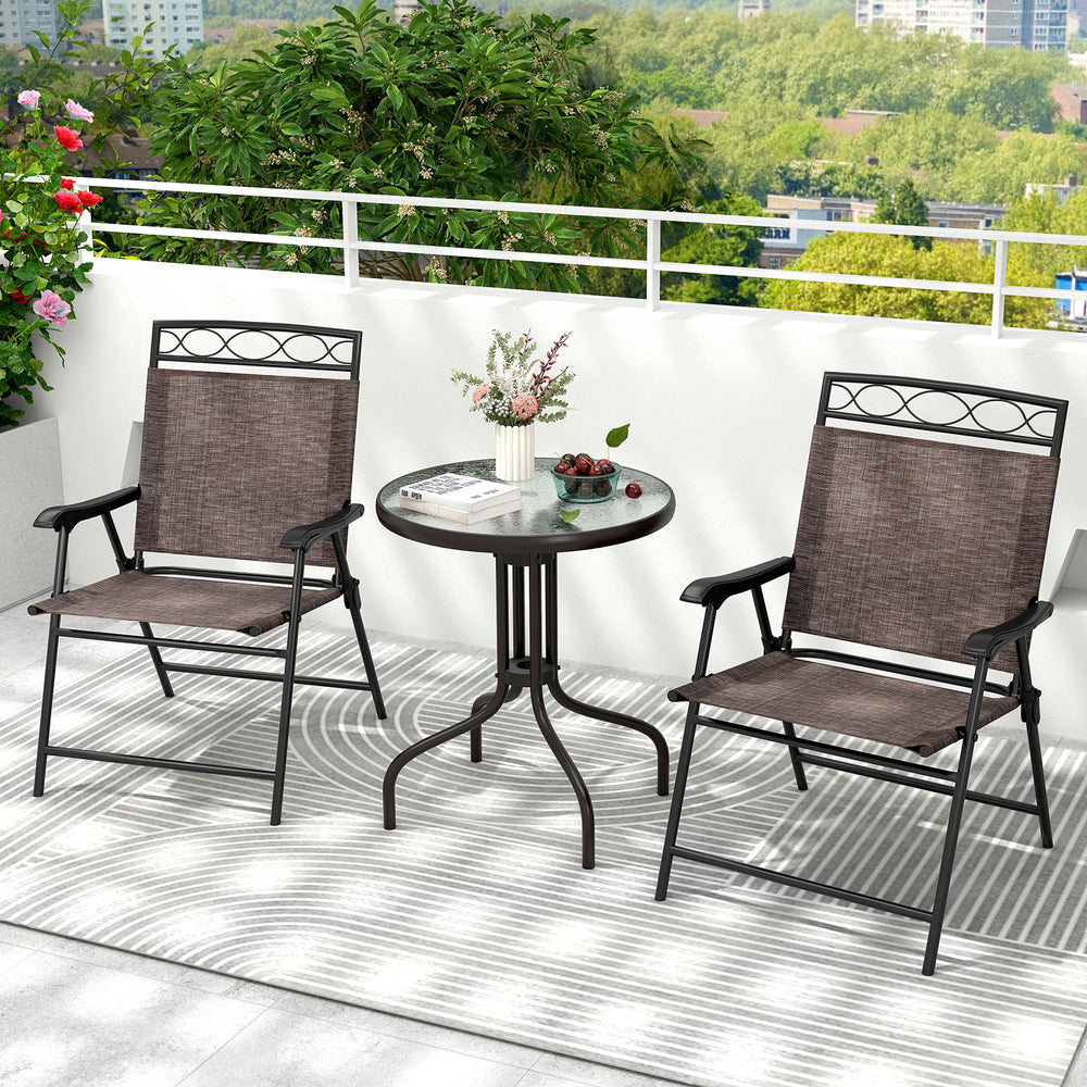 Compact round table with rippled tempered glass and sturdy metal frame, designed for outdoor bistro dining with an.