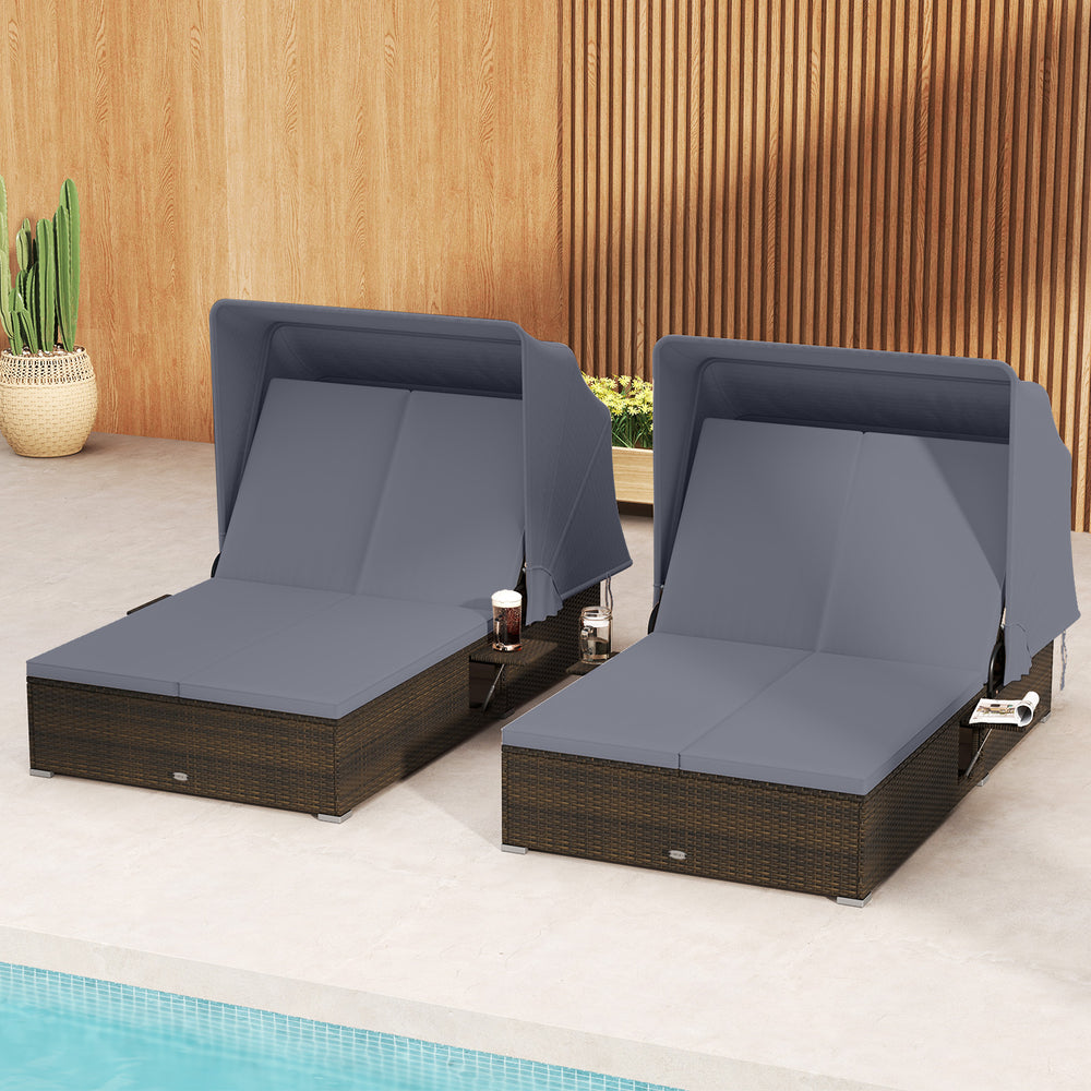 Patio double chaise lounge with gray cushions and retractable canopy, featuring hand-woven PE rattan for poolside.