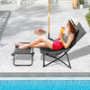 Patio folding sling chair with ottoman in gray, featuring a removable cushion, ideal for poolside relaxation.