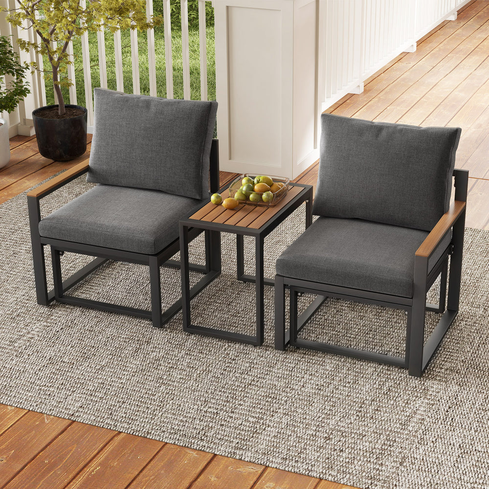 Two gray outdoor chairs with soft cushions and a WPC tabletop, perfect for patio relaxation and conversation.