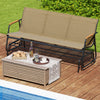 Patio glider bench with curved teak armrests and breathable fabric seat, perfect for backyard or poolside relaxation.