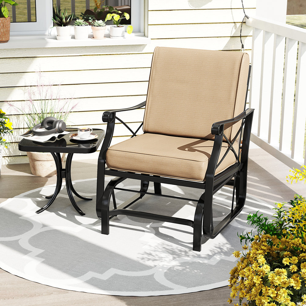 Patio glider rocking chair with thick brown cushions and metal frame, perfect for outdoor relaxation on a porch or.