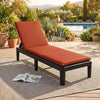Adjustable patio lounge chair with orange cushion, featuring a rattan texture and durable all-weather PP material for.