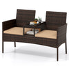 Curved-back patio loveseat made of handwoven PE rattan with beige cushions and built-in coffee table for outdoor relaxation.
