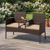 Patio loveseat set in brown wicker features ergonomic curved back, high-density cushions, and built-in coffee table for outdoor relaxation.