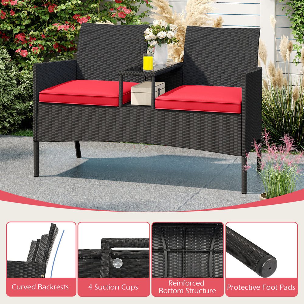 Patio loveseat with built-in table, red cushions, hand-woven PE rattan, perfect for backyard or porch relaxation.
