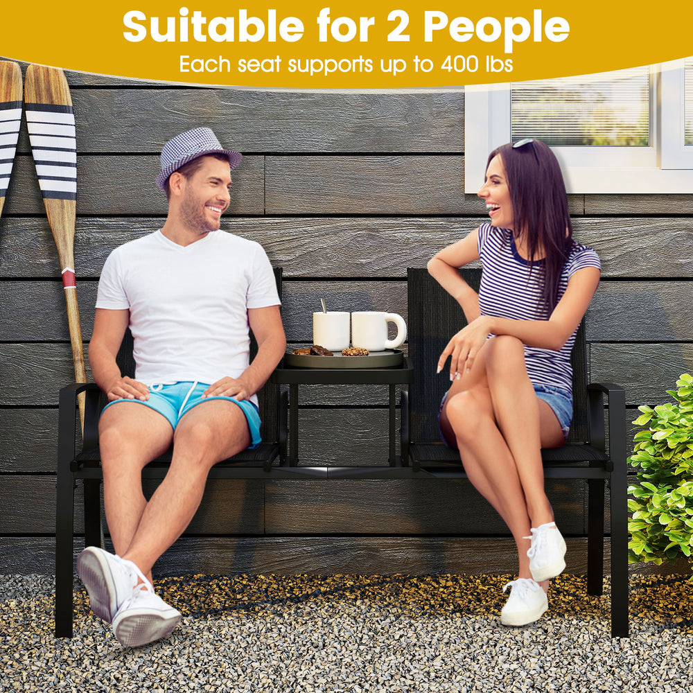 Patio loveseat with built-in table, black breathable fabric, seats 2, ideal for porch or garden relaxation.