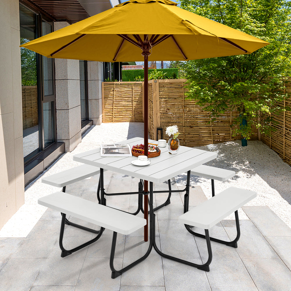 Outdoor picnic table with four benches in white, featuring a spacious surface and umbrella hole for versatile outdoor.
