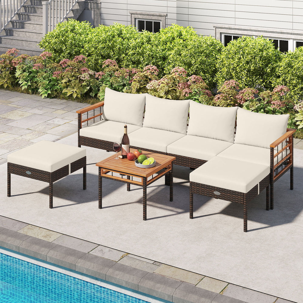 Patio rattan sofa set with white cushions, acacia wood accents, and a coffee table, perfect for poolside relaxation.