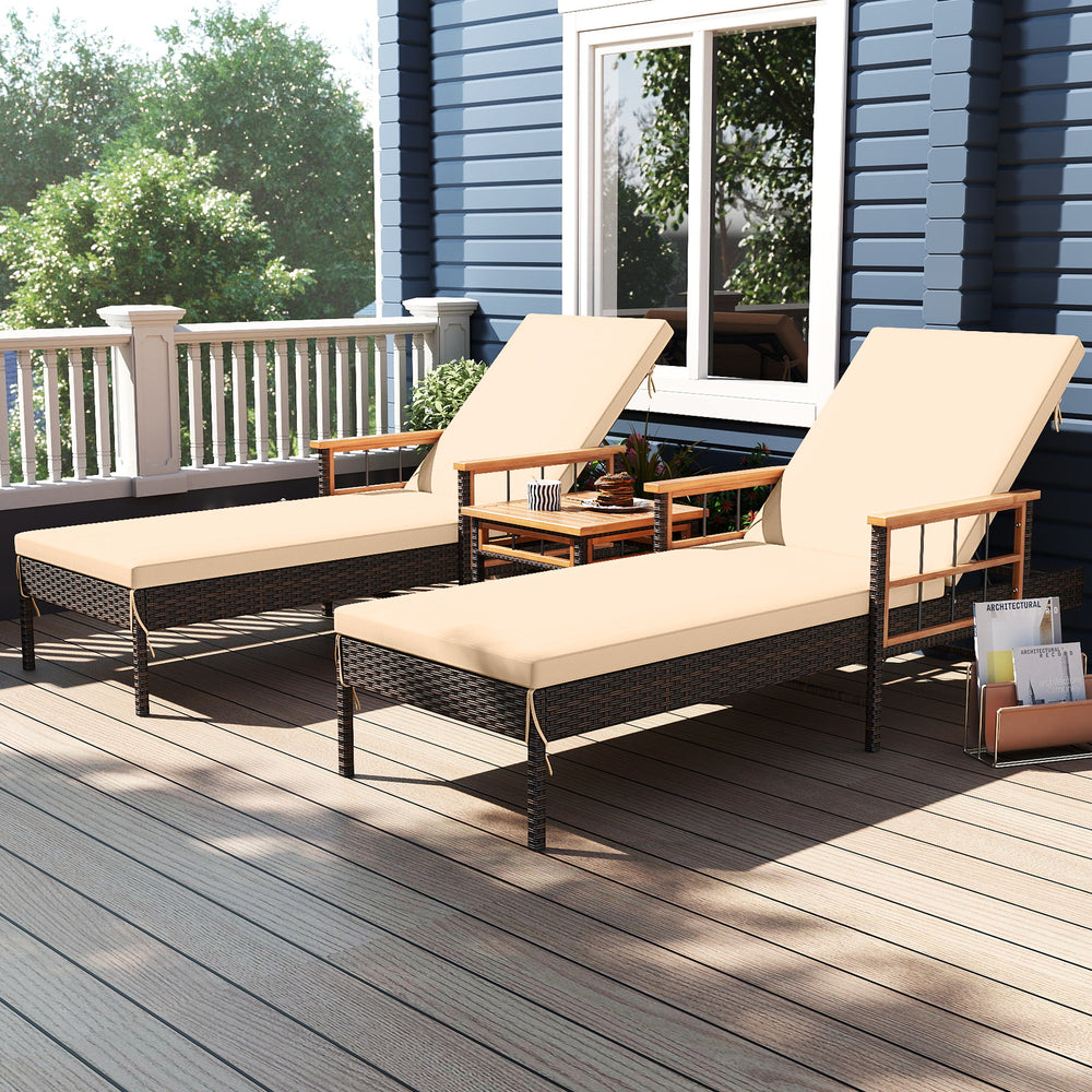 Patio rattan chaise lounge set with adjustable backrest and side table, featuring beige cushions for outdoor comfort.