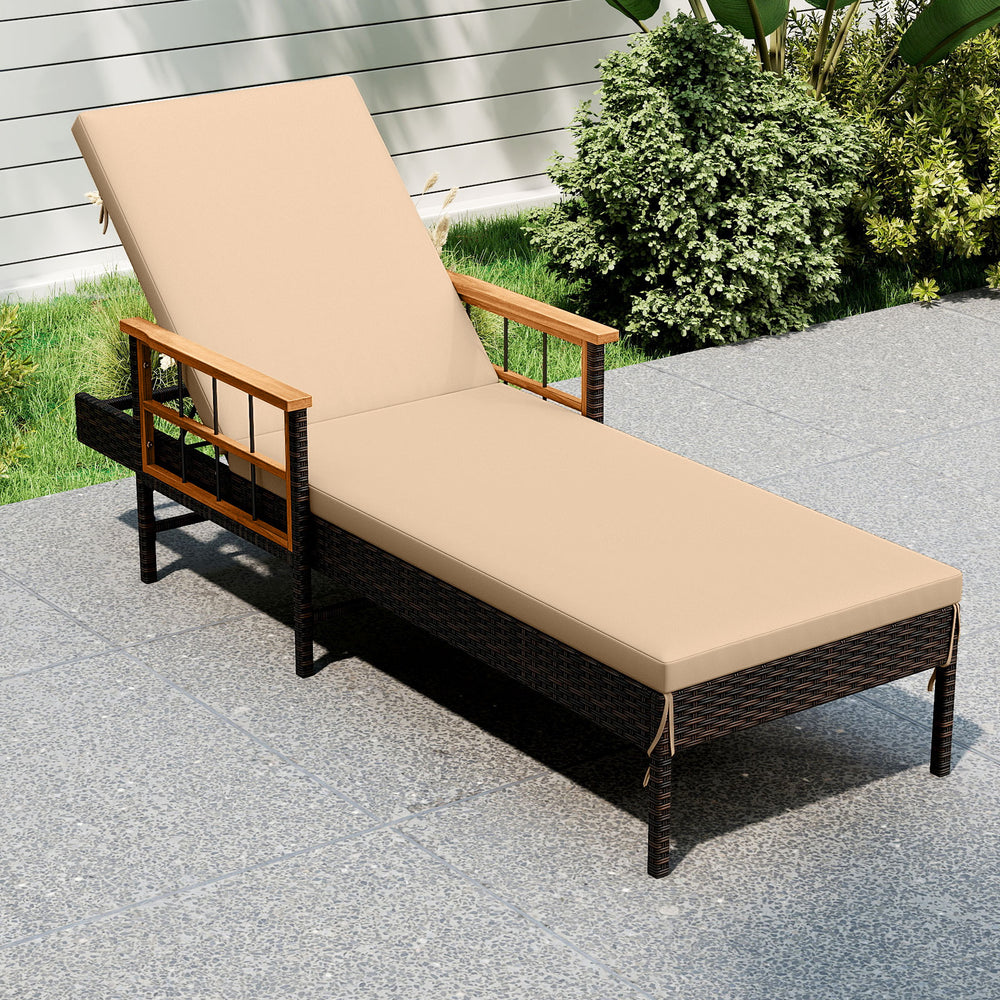 Patio rattan chaise lounge in beige with adjustable backrest and acacia wood armrests for outdoor relaxation.