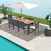 9-piece patio rattan dining set featuring an acacia wood table, perfect for backyard gatherings by the poolside.
