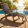 Patio rattan folding lounge chair with acacia wood frame, featuring a retractable footrest, perfect for poolside.