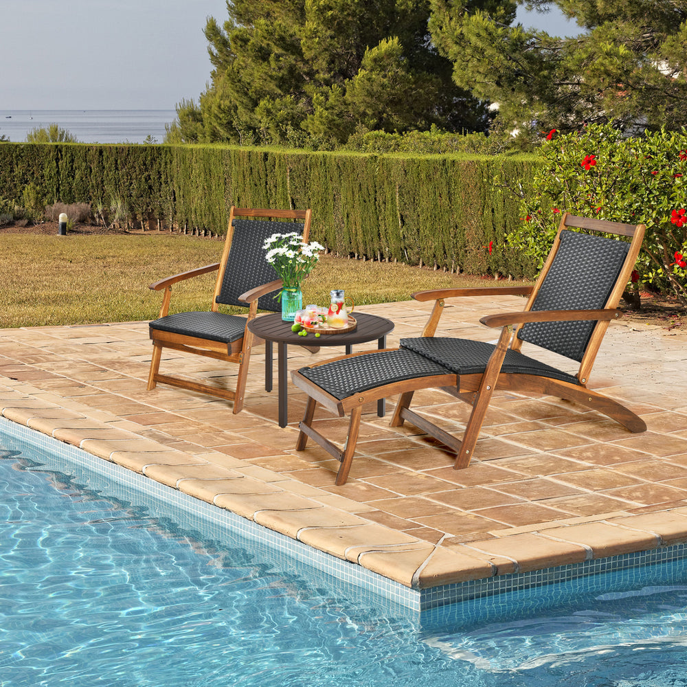 Patio rattan folding lounge chairs with acacia wood frame by the pool, featuring a retractable footrest for comfort.