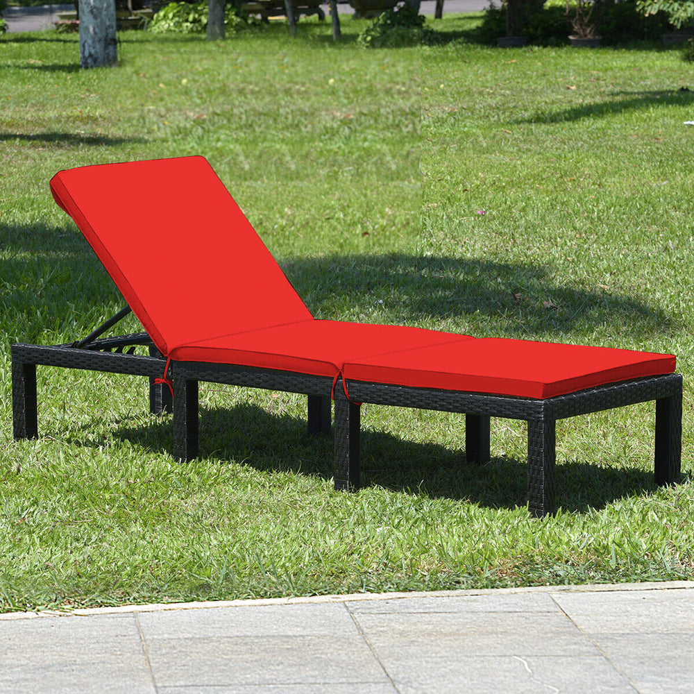 Red cushioned height adjustable lounge chair made of PE rattan and steel, perfect for poolside or patio relaxation.