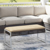Rectangle patio ottoman with beige seat cushion, hand-woven PE rattan, and metal legs for outdoor use.