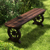 Patio rustic wood bench featuring a wagon wheel base, crafted from carbonized fir, perfect for poolside or front porch.