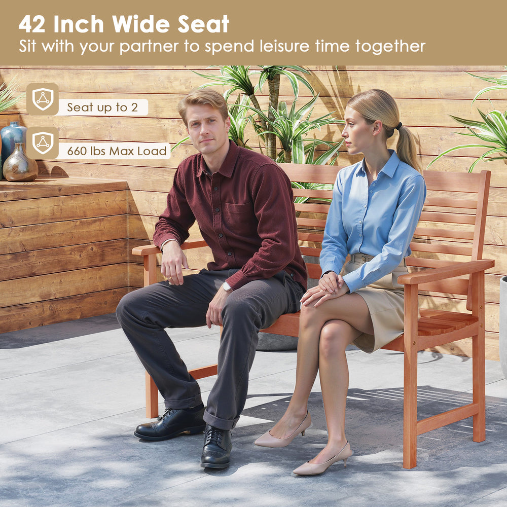 Patio solid wood loveseat with inclined backrest, slatted seat, and widened armrests for outdoor relaxation.