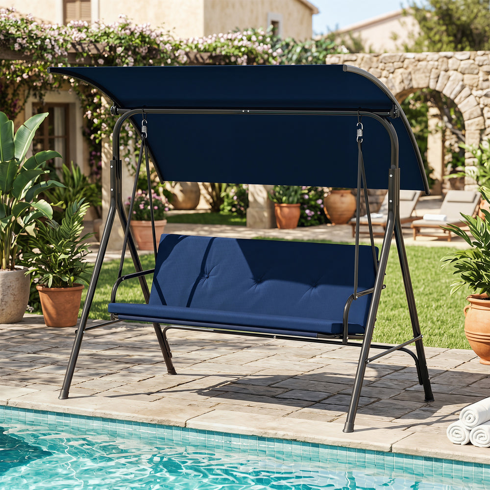 Patio swing chair with adjustable navy canopy and removable cushion, perfect for backyard or poolside relaxation.