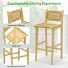 Teak wood bar stool with rattan backrest and wide seat, ideal for outdoor patio and poolside relaxation.