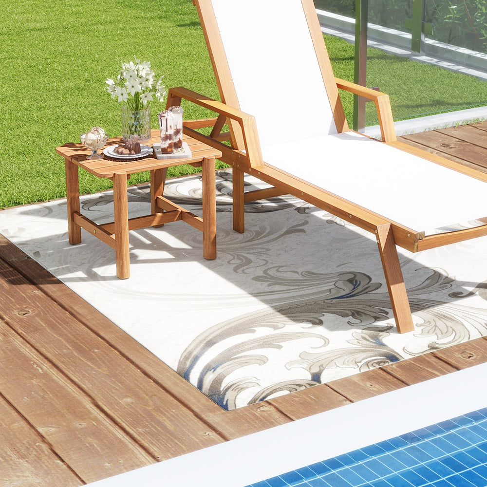 Teak wood side table with slatted tabletop, perfect for poolside or garden use, showcasing natural charm and durability.