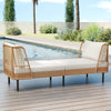 Patio wicker daybed with white cushions, handwoven PE rattan, perfect for outdoor relaxation by the pool.