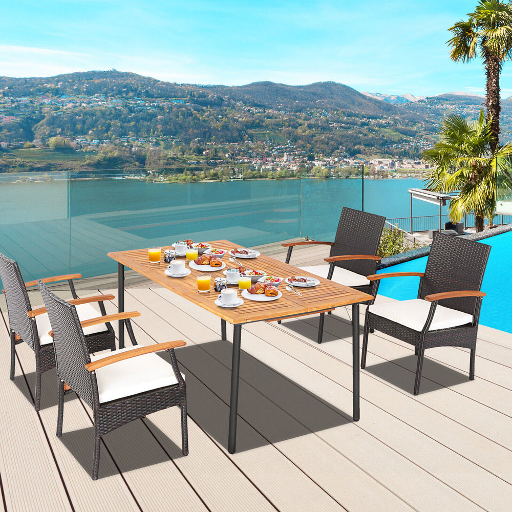 5-piece patio dining set featuring acacia wood table and cushioned PE rattan chairs, perfect for outdoor gatherings.
