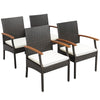 Four cushioned dining chairs made of hand-woven PE rattan with wood armrests, ideal for outdoor patio use.
