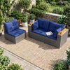 Patio wicker sectional furniture set with navy cushions, featuring acacia wood armrests for outdoor relaxation.