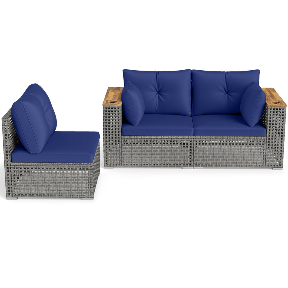 Patio wicker sectional furniture set in navy with removable cushions and acacia wood armrests for garden relaxation.