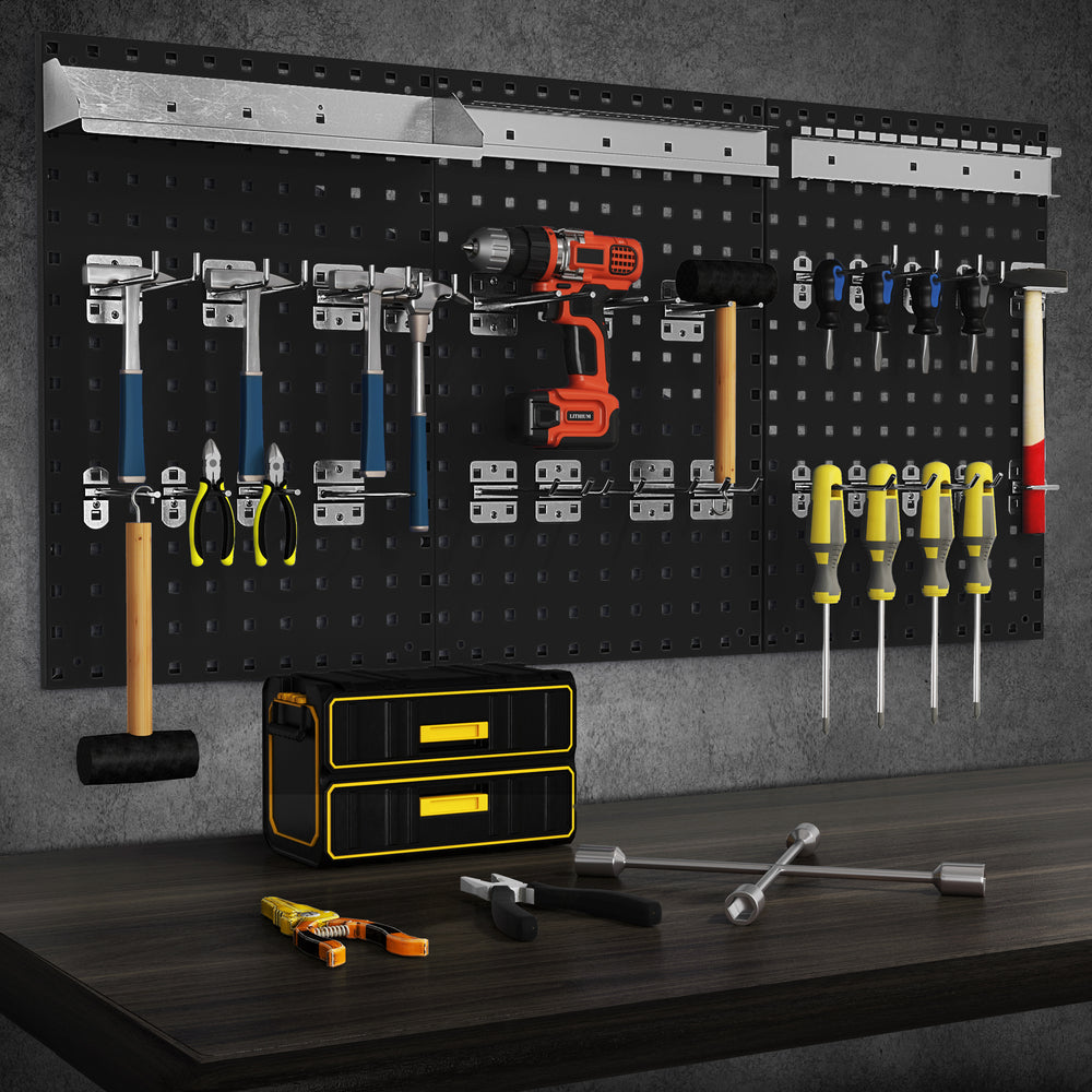 Wall-mounted pegboard kit with tools organized, featuring 3 metal boards and assorted hanging accessories for garage.