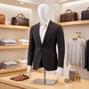 Plastic half body male mannequin with adjustable arms and head, ideal for displaying suits and shirts in retail settings.