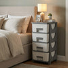 Compact gray plastic storage organizer with four drawers and spacious tabletop, ideal for bedroom use and easy access.