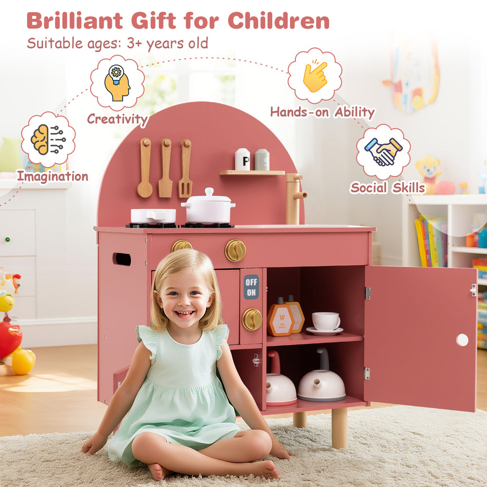 Wooden play kitchen set in pink with stove, sink, and oven, promoting creativity and social skills for kids aged 3+.