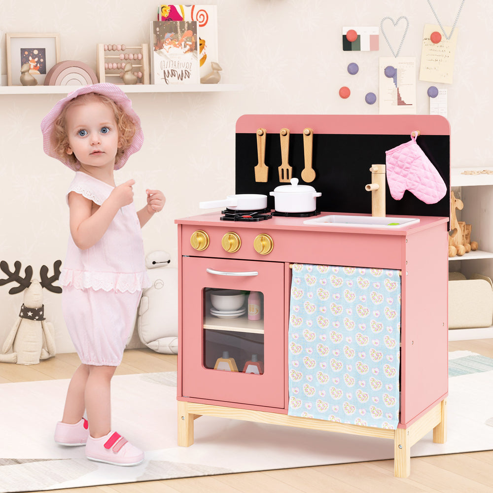 Wooden pink play kitchen set with stove, sink, and oven, featuring rotary knobs and storage for kids aged 3+.