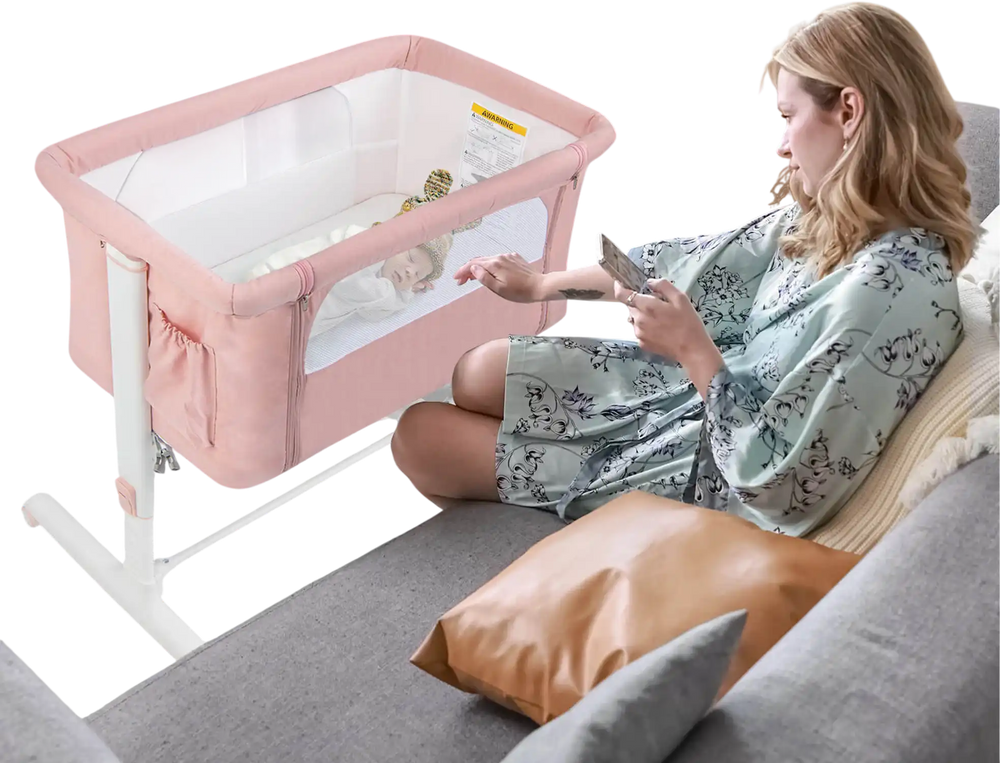 Portable pink baby bedside bassinet with adjustable height, breathable mesh, and travel bag for convenient use.