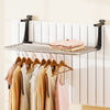 Portable aluminum clothes drying rack with adjustable brackets, featuring 7 bars for hanging multiple items indoors or.
