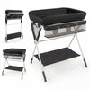 Portable baby changing table in black with adjustable height, storage basket, and foldable design for easy use.