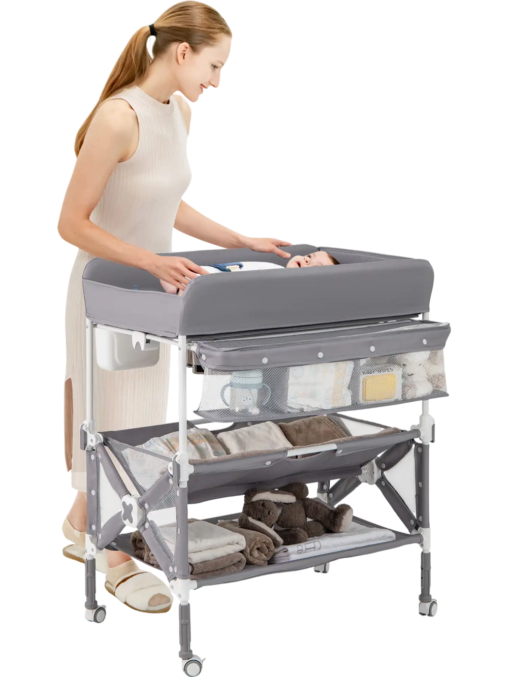 Gray portable baby changing table with a spacious tabletop and two-tier shelf, designed for easy mobility and.