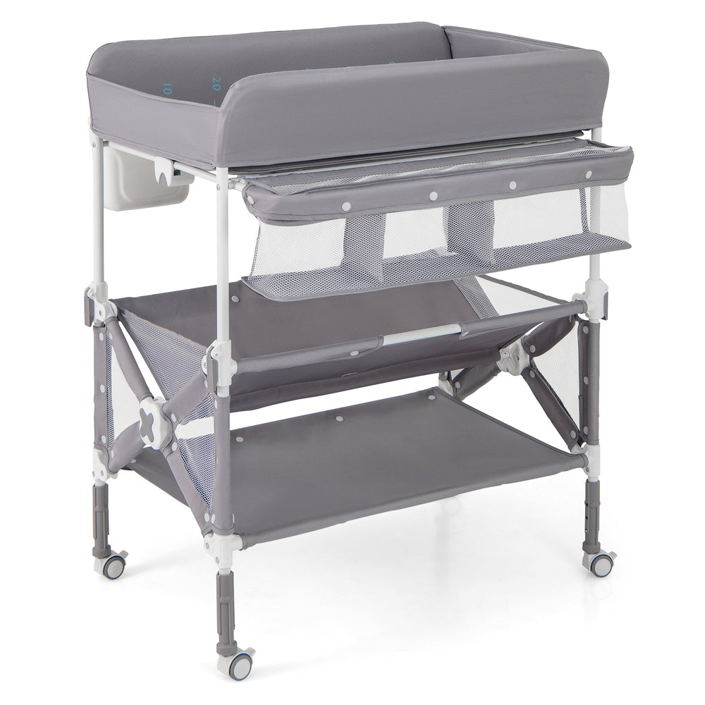 Portable baby changing table in gray with wheels, large storage rack, and adjustable height for convenience.
