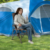 Portable camping chair with 400 lbs metal frame, featuring a cup holder, set up outdoors for camping comfort.