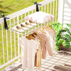 Portable aluminum clothes drying rack with adjustable brackets, featuring 7 bars for hanging items on a balcony.