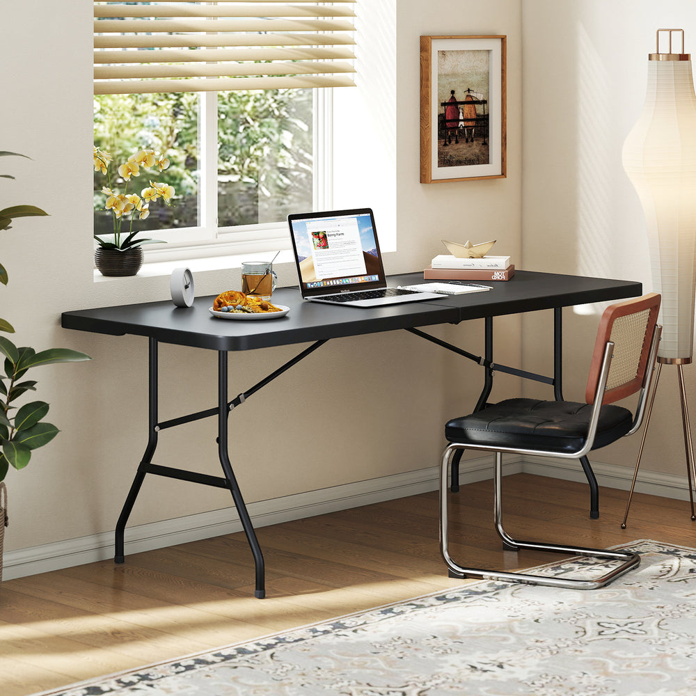 Portable folding camping table in black with a large tabletop, sturdy steel frame, ideal for outdoor and indoor use.