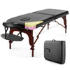 Folding massage table with height-adjustable beech wood frame, black PU leather, and memory foam for ultimate comfort.