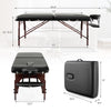 Folding massage table in black with adjustable height, memory foam padding, and beech wood frame for comfort and.